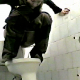 A woman is video-recorded pissing & shitting while squatting above a toilet. The view is clear, but there is no audio.